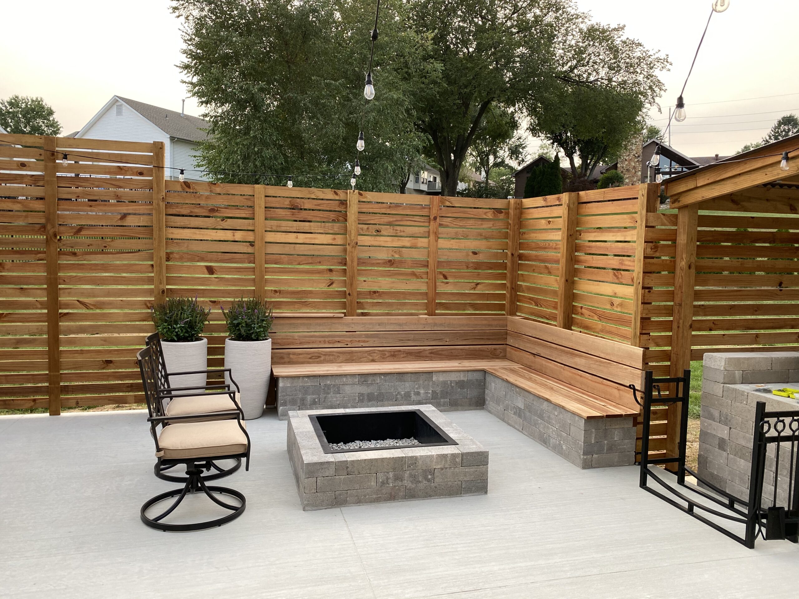 Furnished back patio with privacy fence