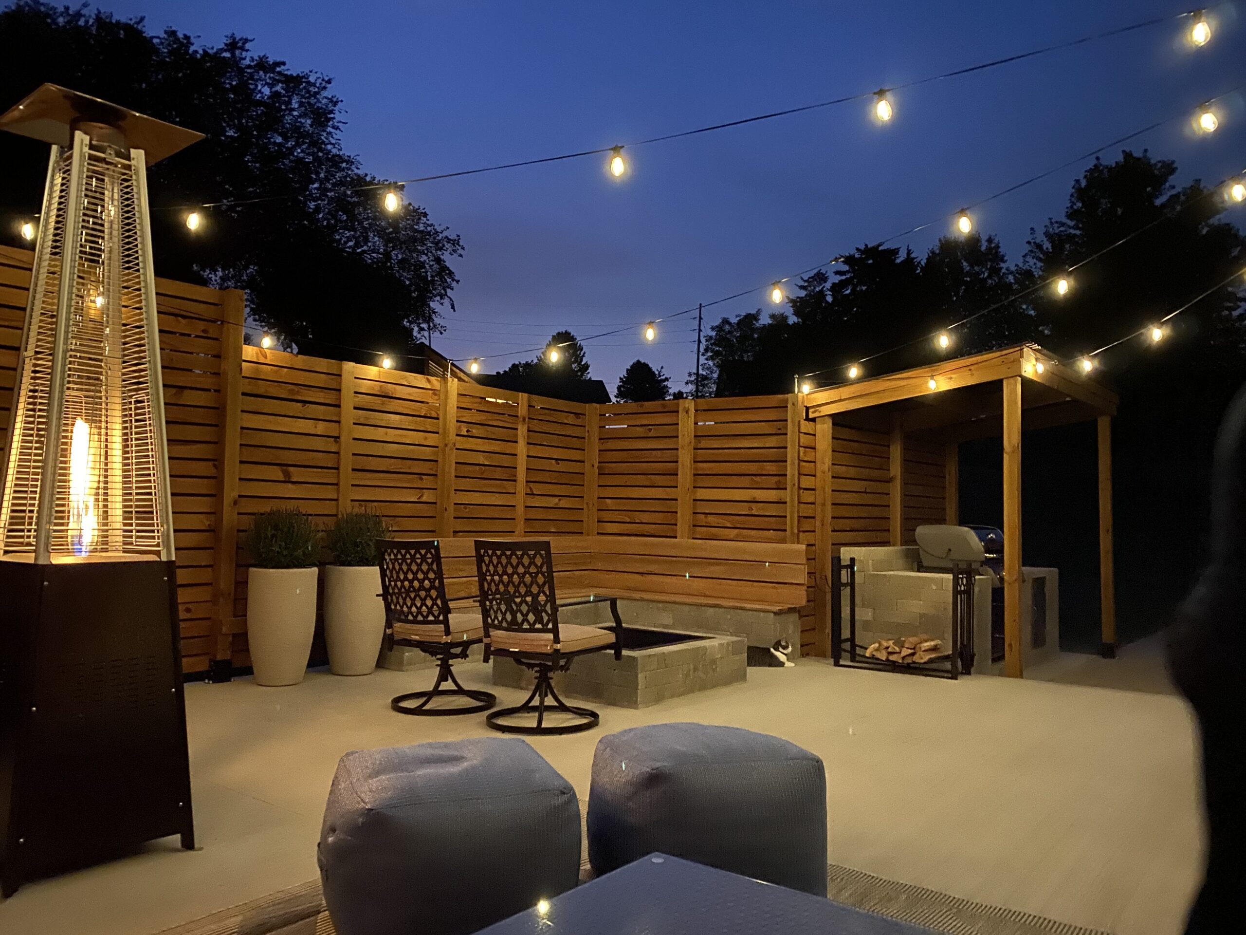 Furnished back patio with privacy fence