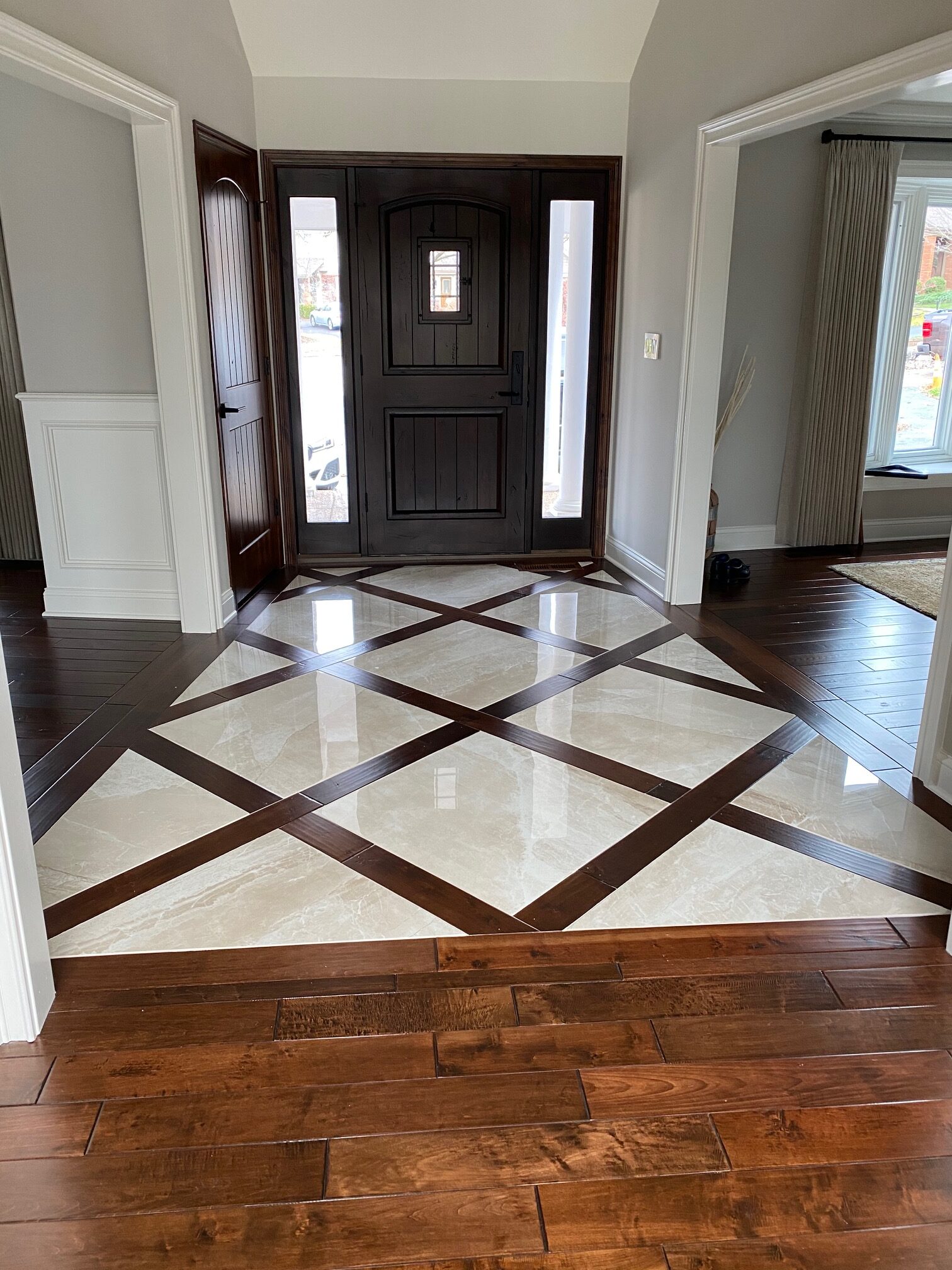 Entryway with mix of wood flooring and tile flooring