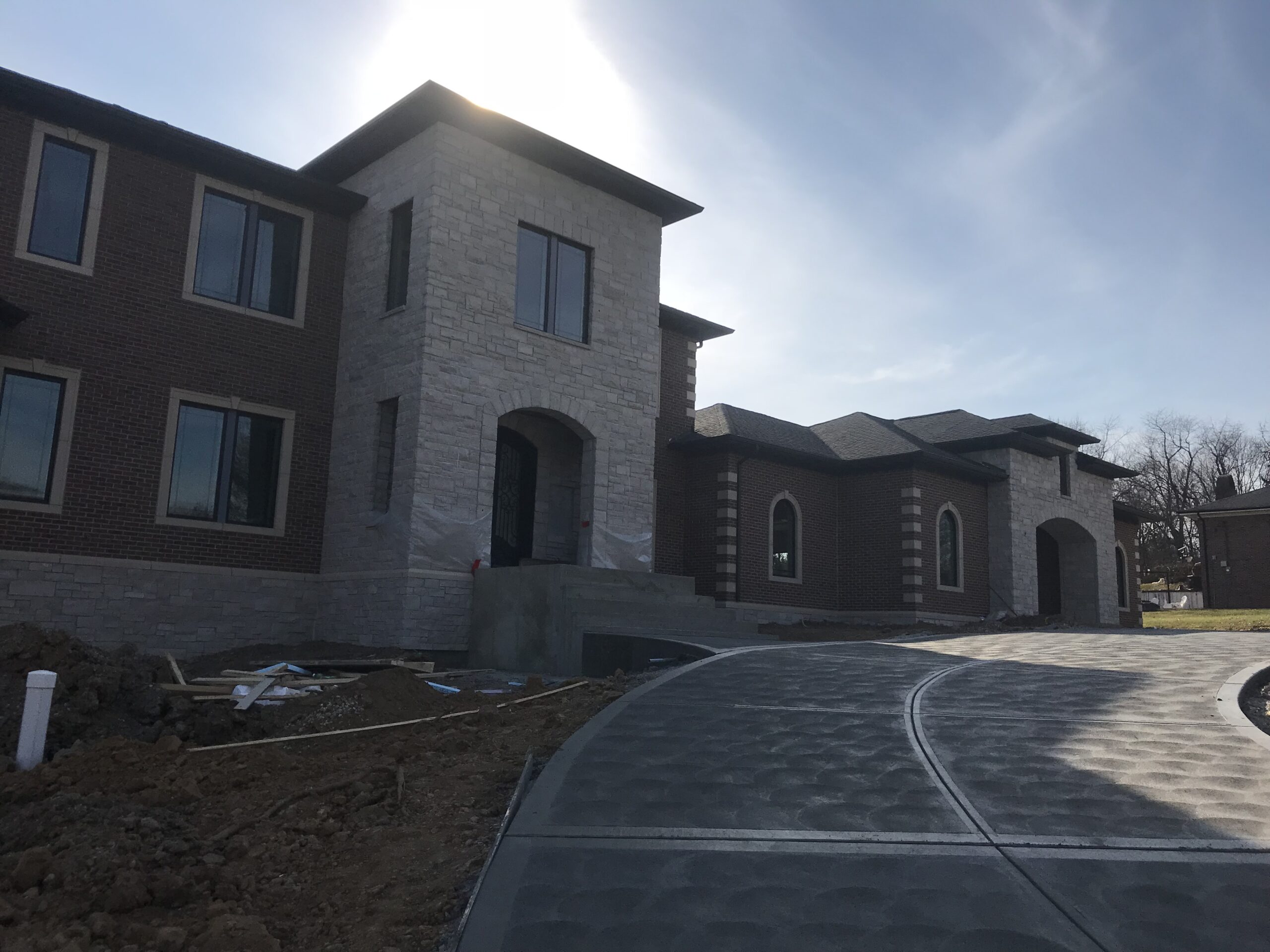 Front of house with stairs and driveway