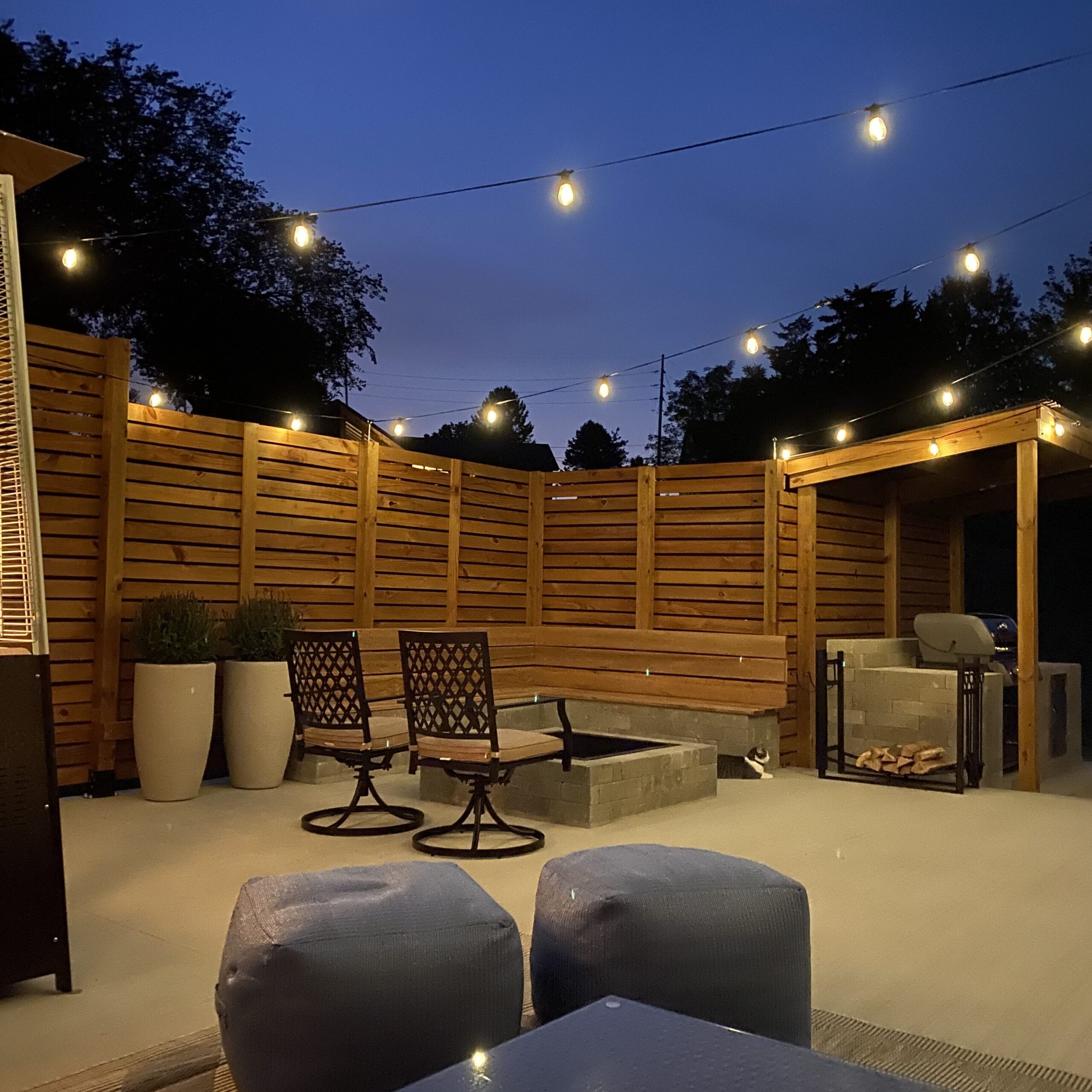 Furnished back patio with privacy fence