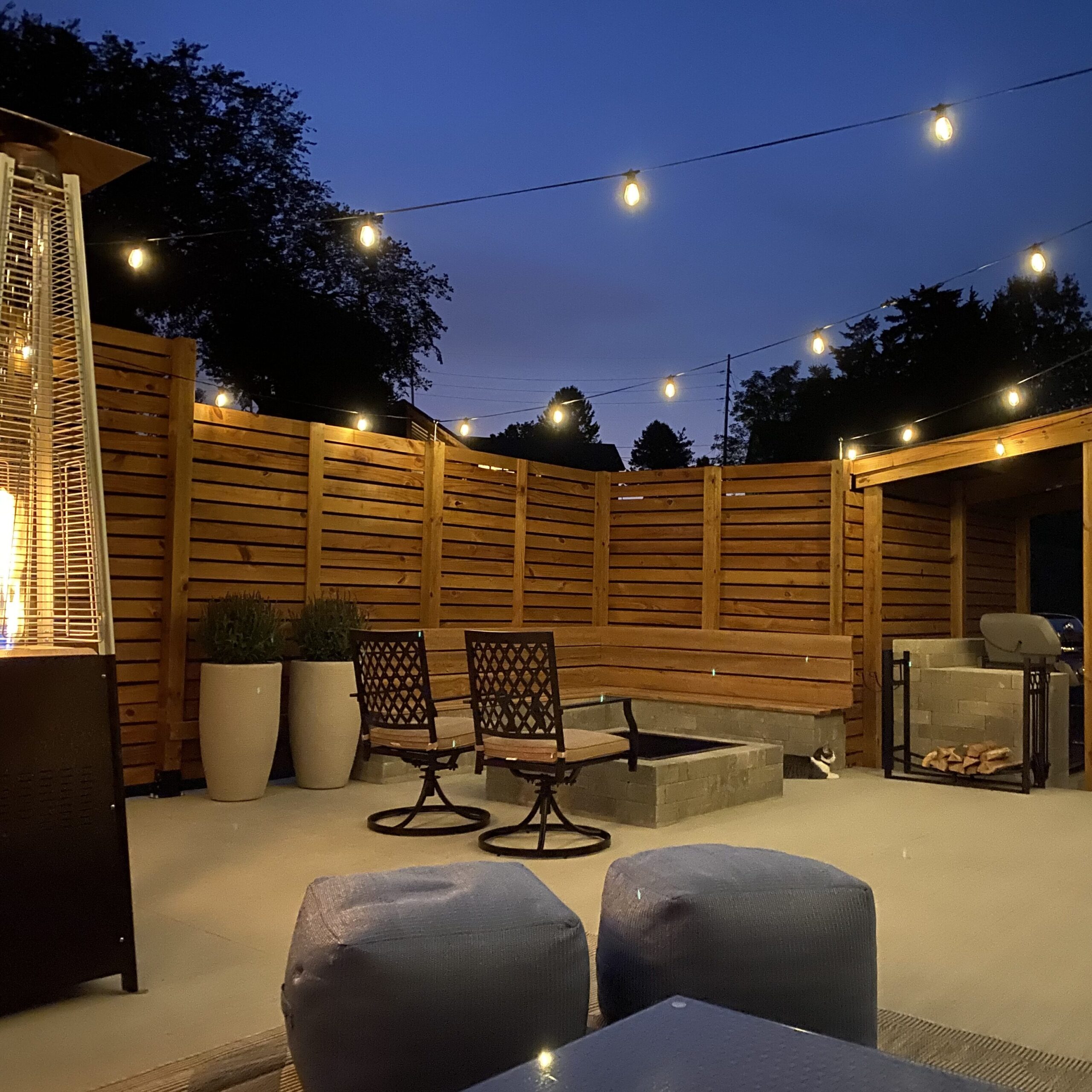 Furnished back patio with privacy fence